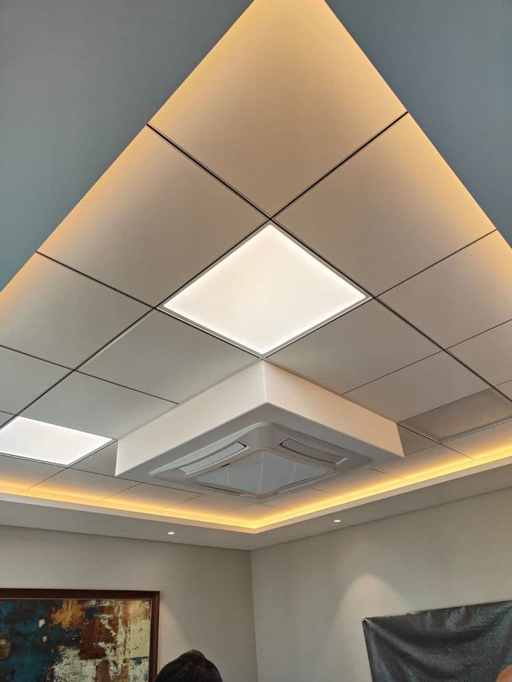 Diamond-pattern grid ceiling with cove lighting and AC diffuser, Chandigarh office