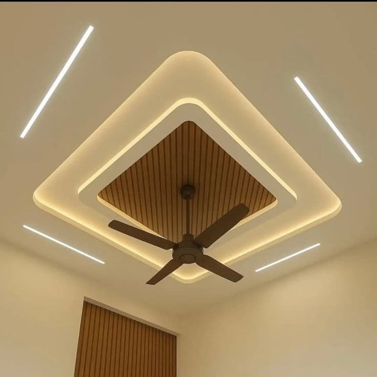 Diamond-shaped gypsum false ceiling with wooden fluted panel centre and cove lighting