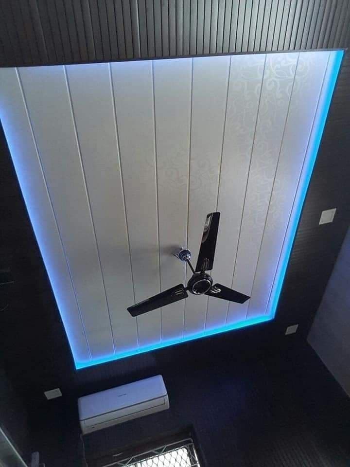 White PVC panel ceiling with blue LED border lighting and ceiling fan, Chandigarh