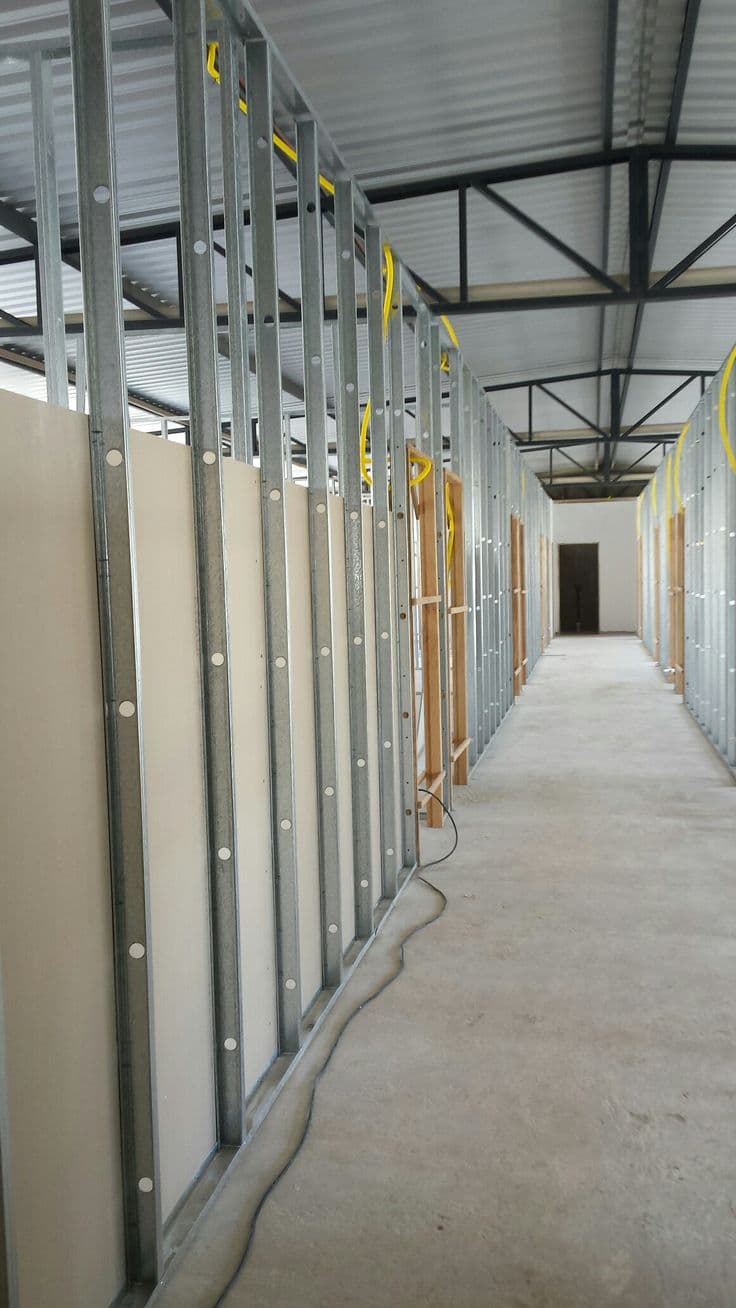 Metal-stud gypsum partition wall framing under construction in a Chandigarh commercial space
